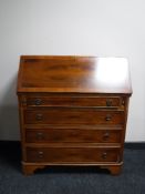 An inlaid yew wood bureau