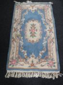 Two Chinese rugs on blue ground