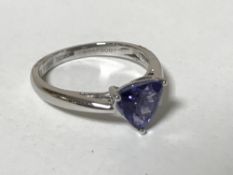 A platinum triangular cut tanzanite ring, size K.