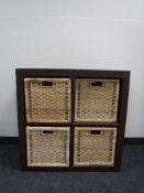 A contemporary storage unit with four wicker drawers