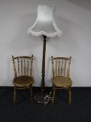 A pair of Ibex kitchen chairs and a standard lamp
