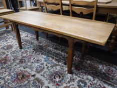 A mid 20th century blonde oak refectory coffee table