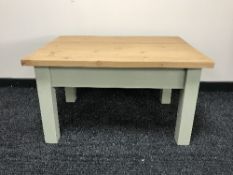 A pine coffee table on painted legs