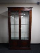 A Chapmans Siesta mahogany double door bookcase