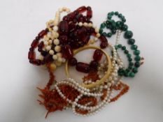 A small collection of necklaces - pearls, malachite,