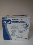 A boxed Jabsco Twist N Lock manual toilet and a glass vase
