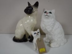 Three Beswick cat figures - Siamese cat no. 1882, in a gloss finish, Persian cat no.