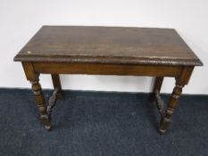 A carved oak hall table