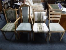 A blonde oak carver arm chair and three odd chairs