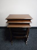 A nest of three mahogany tables