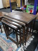 A nest of four Eastern brass inlaid tables