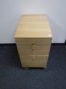 A contemporary office three drawer pedestal chest