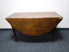 An antique mahogany gate leg table