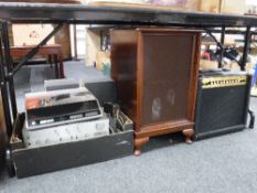 A Marshall amplifier, Technics amp, VCR DVD player, two speaker cabinets with speakers,