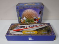 A boxed Walt Disney World Monorail and Spaceship Earth accessory (2)