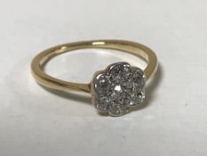 An 18ct gold diamond cluster ring CONDITION REPORT: The ring is in good condition.