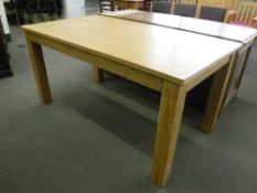 A contemporary oak dining table