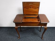 An antique mahogany correspondence table