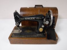 An oak cased mid twentieth century Singer hand sewing machine