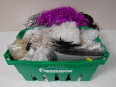 Two boxes containing assorted wigs