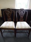 A pair of antique mahogany shield back dining chairs