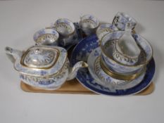 A tray containing a 20 piece white, blue and gilt Oriental tea service,