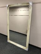A cream framed over mantle mirror, 90cm x 151cm