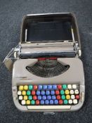 A cased Scheidgger Princess Matic vintage typewriter