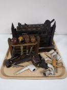 A tray containing four early twentieth century wooden pipe stands,