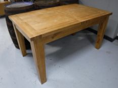 A contemporary oak refectory dining table
