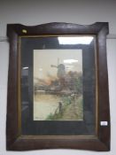 An early twentieth century oak framed watercolour, Dutch windmill scene,