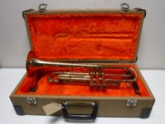 A brass Lafleur trumpet in case