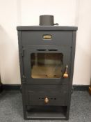 A metal Prity stove, 39cm x 75.
