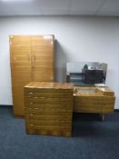 A mid twentieth century walnut three piece bedroom suite