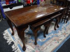 A brass inlaid Eastern table fitted two beneath