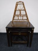 A nest of two contemporary tables with metal mounts,