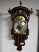 A brass faced mahogany wall clock,