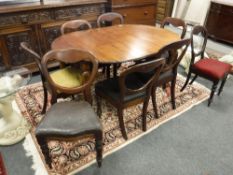 A Victorian mahogany wind out dining table on claw and ball feet,