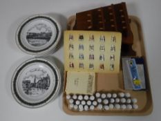 A tray of collection of china thimbles and stands, three collector's spoons,