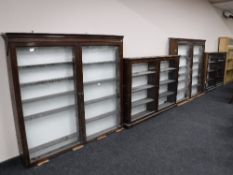 An antique mahogany glazed door chemist's cabinet in four sections