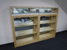 A bespoke built double door display cabinet