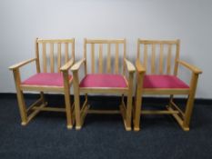 A set of eleven beech framed armchairs