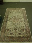 An Indian floral rug on ivory ground