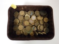 Two tubs of pre decimal foreign and English coins including half pennies, crowns,