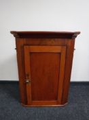 A Victorian mahogany hanging corner cupboard