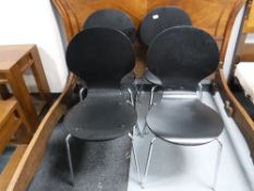 Four stacking chairs on chrome legs