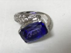 A 14ct gold tanzanite ring set with diamond shoulders, 7.3g, size J.