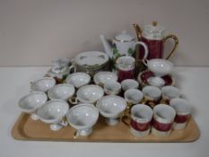 A tray containing two continental tea services