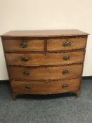 A Victorian mahogany five drawer bow fronted chest,