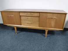 A mid 20th century teak sideboard